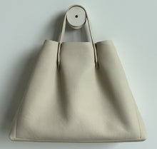 Load image into Gallery viewer, bookbag frrry champagne colour. soft lindos calf leather.