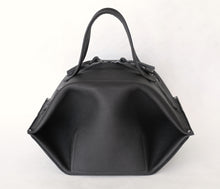 Load image into Gallery viewer, pumpkin frrry. foldable bag. black leather. zipper closure