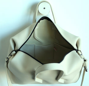 Wednesday frrry bag. Champagne colour. open view. three inside pockets.