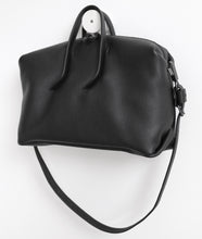 Load image into Gallery viewer, Wednesday frrry bag. black. handle attachment. folded corners. shoulder strap.
