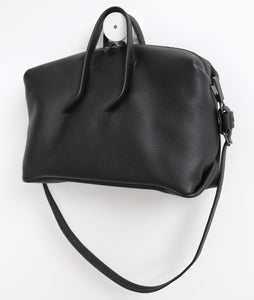 Wednesday frrry bag. black. handle attachment. folded corners. shoulder strap.