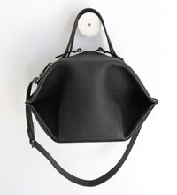 Load image into Gallery viewer, pumpkin frrry. foldable bag. black leather. round shape. plump. zipper closure.
