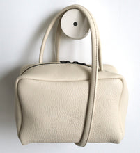 Load image into Gallery viewer, Tuesday. small frrry bag. shoulder bag. hand-held-bag. evening bag. thin strap. zipper closure. Champagne colour.
