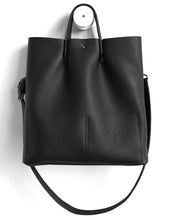 Load image into Gallery viewer, Monday frrry tote bag. shoulder strap. black. back view. button closure
