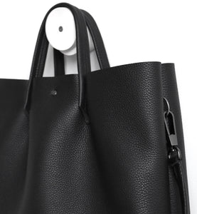 Monday frrry tote bag. shoulder strap.  black. detail view. snap hook. ring .