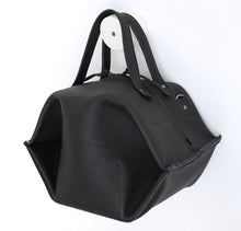 Load image into Gallery viewer, pumpkin frrry. foldable bag. black leather. side view. shoulder strap.
