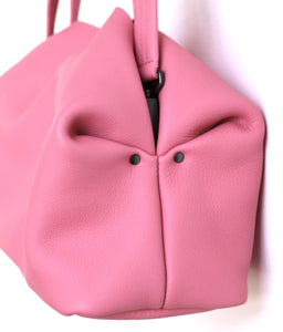 owl frrry bag leather. pink. side view. owl face. folded corners. construction.