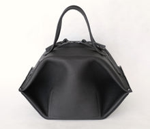 Load image into Gallery viewer, pumpkin frrry. foldable bag. black leather. zipper closure
