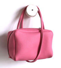 Load image into Gallery viewer, Tuesday. small frrry bag. shoulder bag. hand-held-bag. evening bag. thin strap. zipper closure. pink colour.
